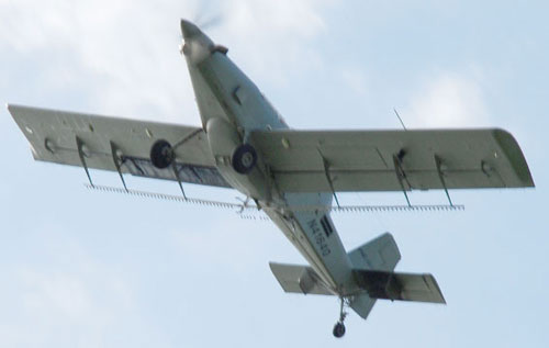 Plane with tubing attached to the wing that is used for the fumigation